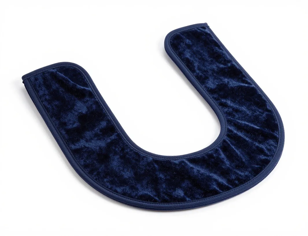 Anatomical U-shaped weighted shoulder wrap in deep navy cotton velour laid flat